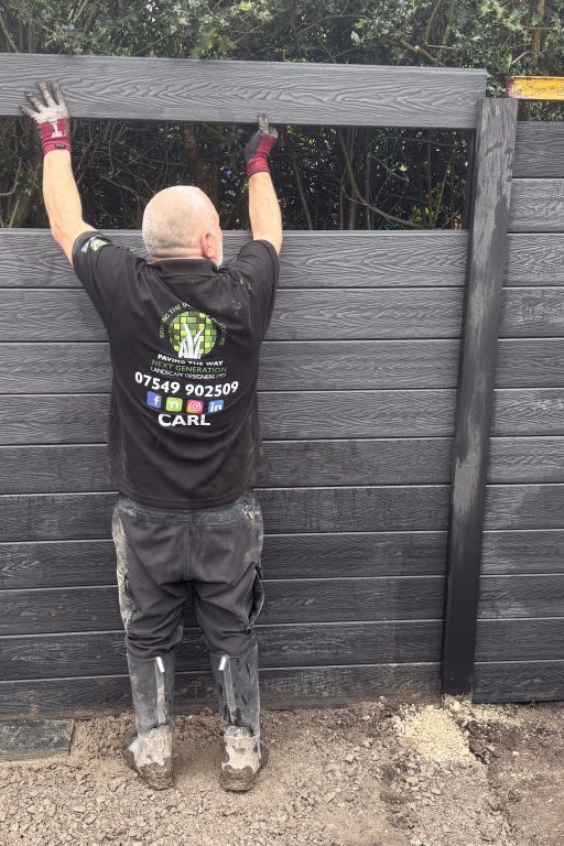 Carl building a fence